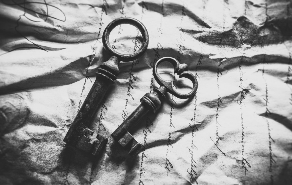 black and white image depicting two keys